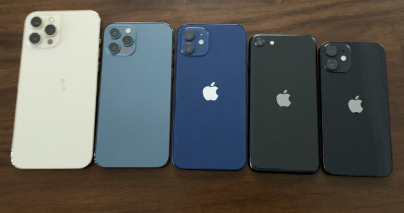 Five iPhones on a table