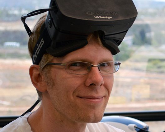 John Carmack, seen here wearing an early prototype Oculus Rift headset.