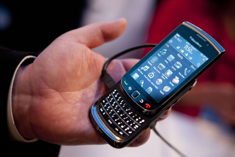 The Blackberry Torch, the company's first touchscreen phone, is held for display during its debut in New York in 2010.