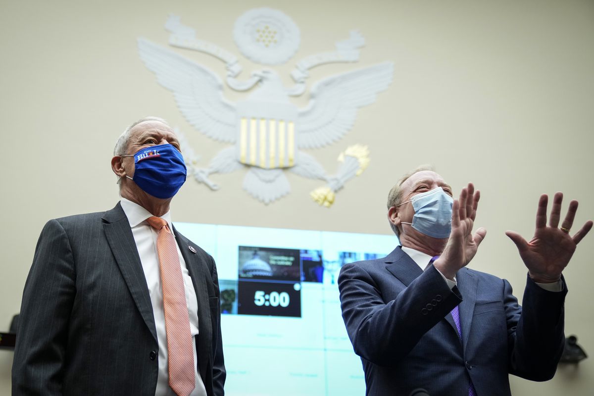 Rep. Ken Buck (R-CO) and president of Microsoft Brad Smith arrive for a House Judiciary antitrust subcommittee hearing on regulation and competition in the news media industry on March 12, 2021.