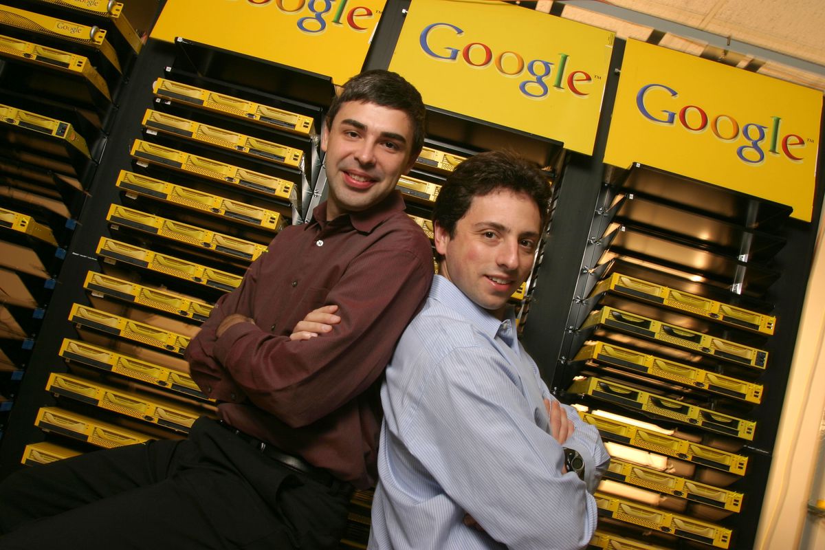 Google co-founders Larry Page and Sergey Brin pose inside the server room at Google’s headquarters.